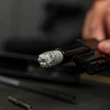 Product lifestyle image of Shooter's Choice .45cal Pistol Cleaning Kit bore mop in use