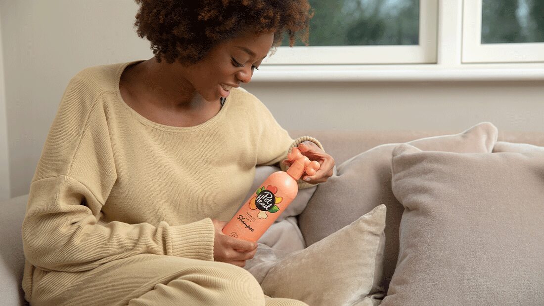 Lady holding Quick Fix Shampoo