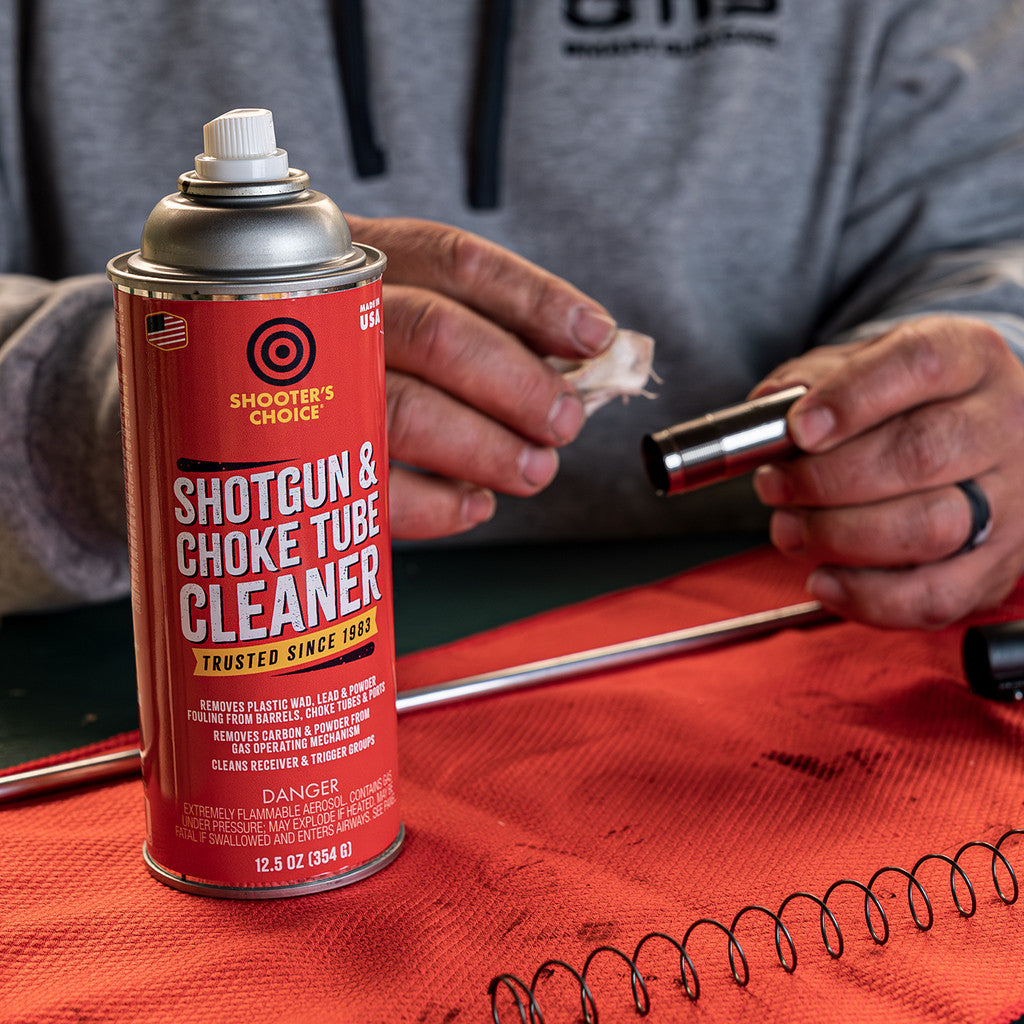 Product image of Shooter's Choice Shotgun and Choke Tube Cleaner  in use cleaning a shotgun choke tube