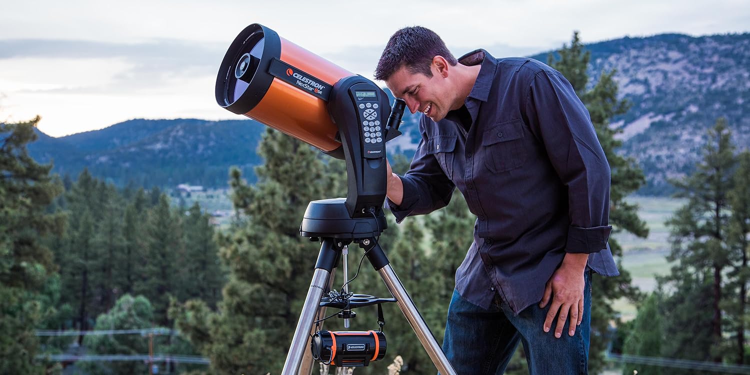 A man using the NexStar 8SE telescope