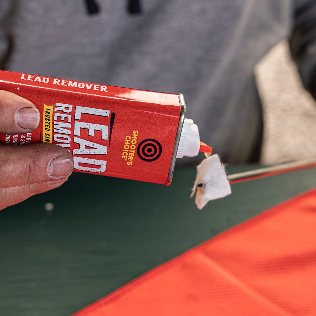 Shooter's Choice Lead Remover 4oz being applied to a gun cleaning patch