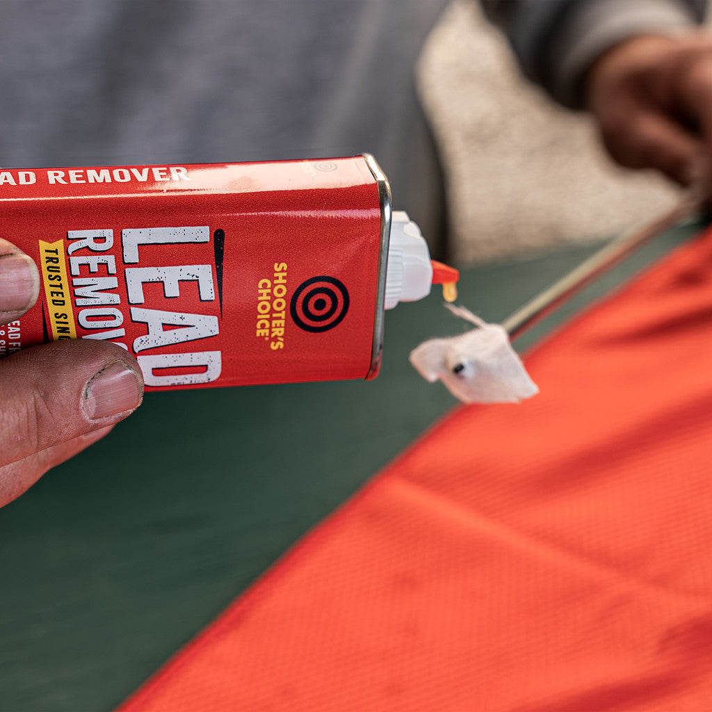 Shooter's Choice Lead Remover 4oz in use being applied to a gun cleaning patch