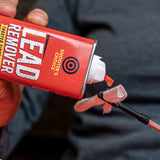 Shooter's Choice Lead Remover 4oz lifestyle image of product in use being applied to a slotted tip and patch