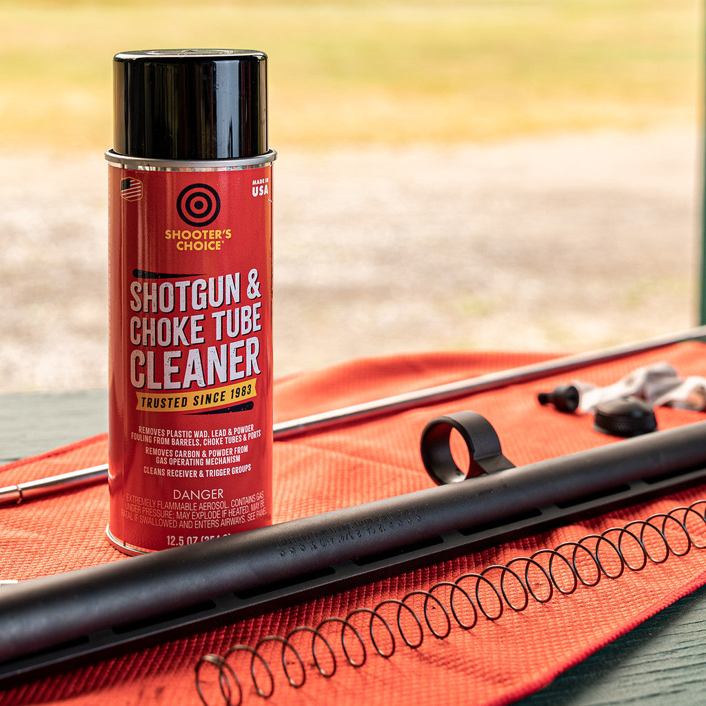 Sill life image of Shooter's Choice Shotgun and Choke Tube Cleaner with a shotgun barrel 